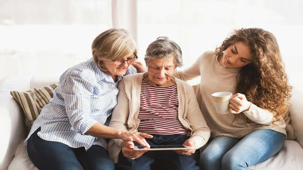 A grandma sharing stories with her daughter and granddaughter