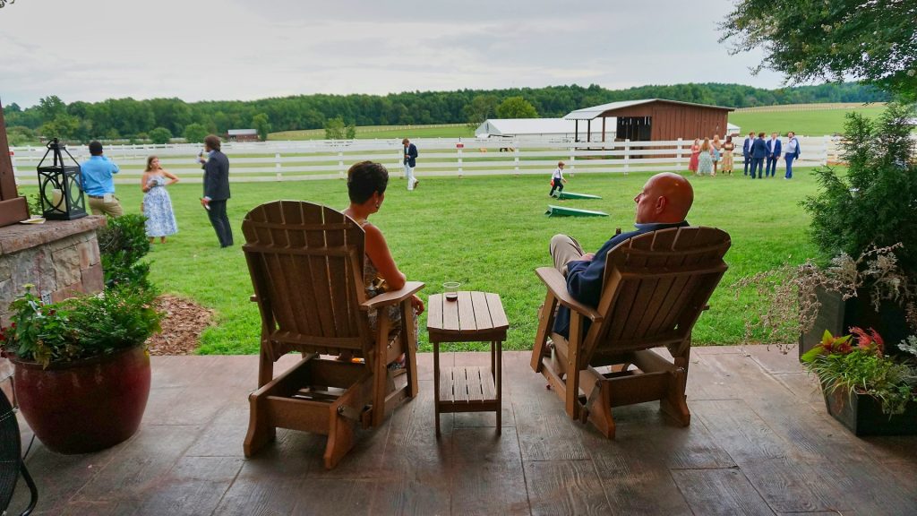 couple sitting with family in background