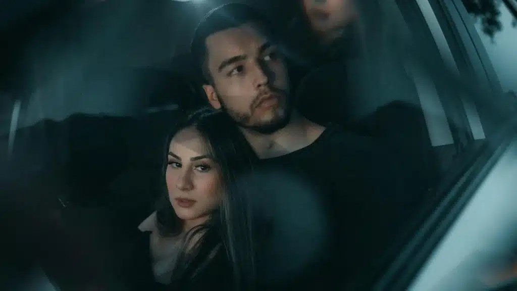 A man and woman in a car.