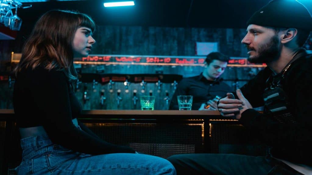 A couple at a bar 