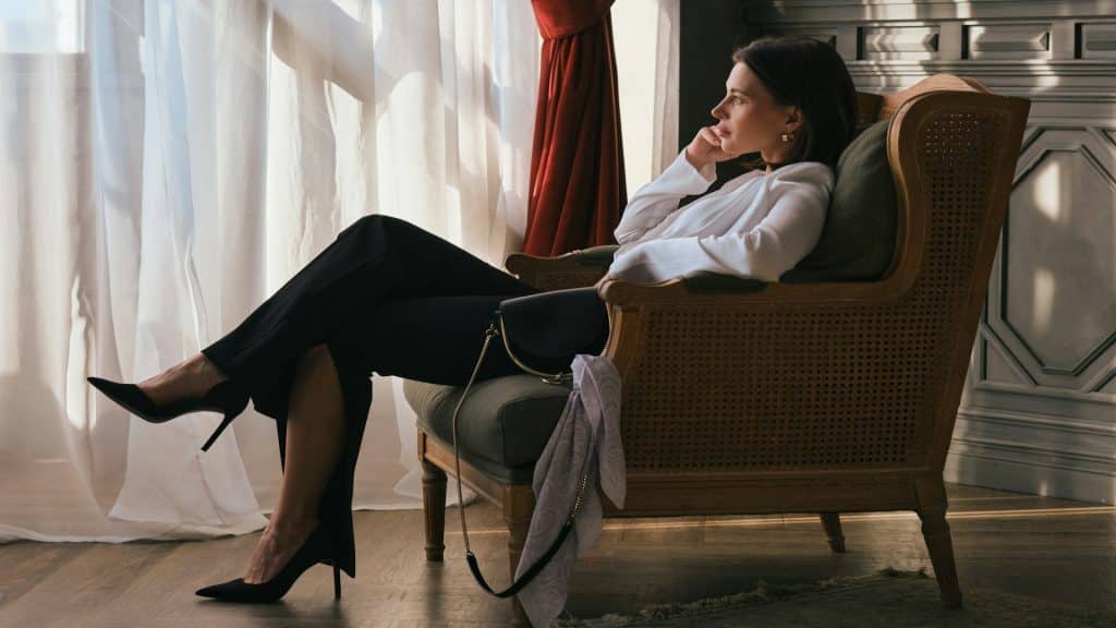 woman sitting quietly looking thoughtful