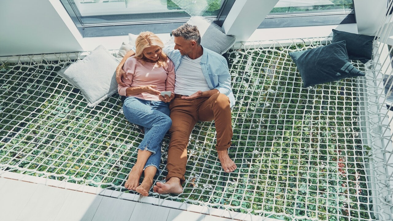 A mature couple cuddling