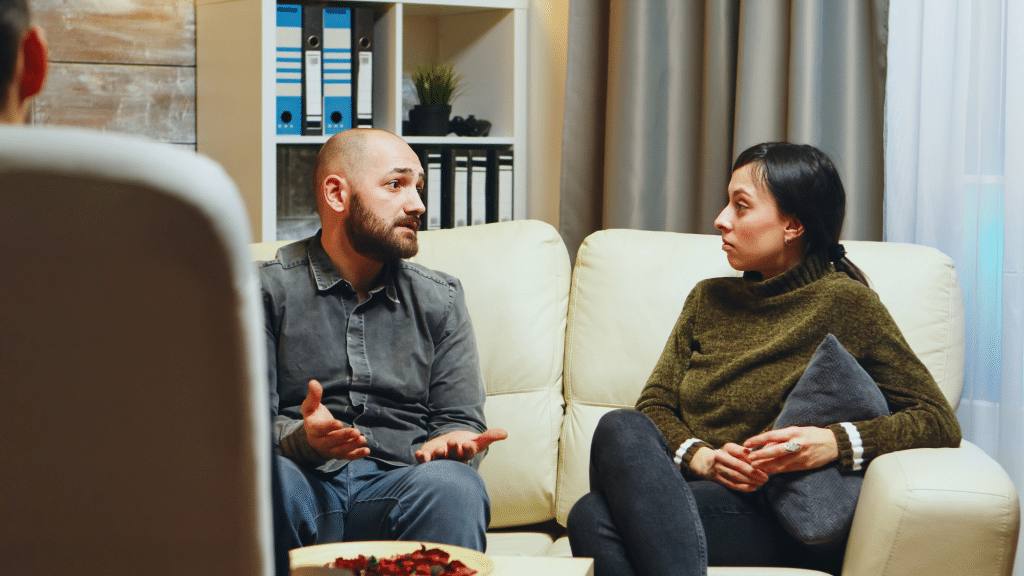 Couple having serious conversation on a couch