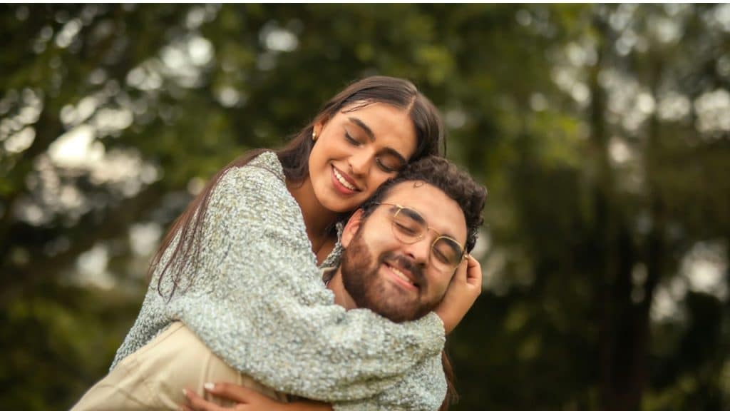 A man holding a woman on his back.