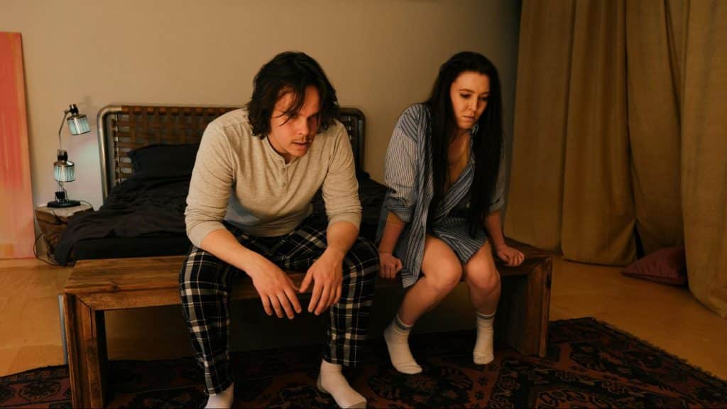 A man and woman sitting 