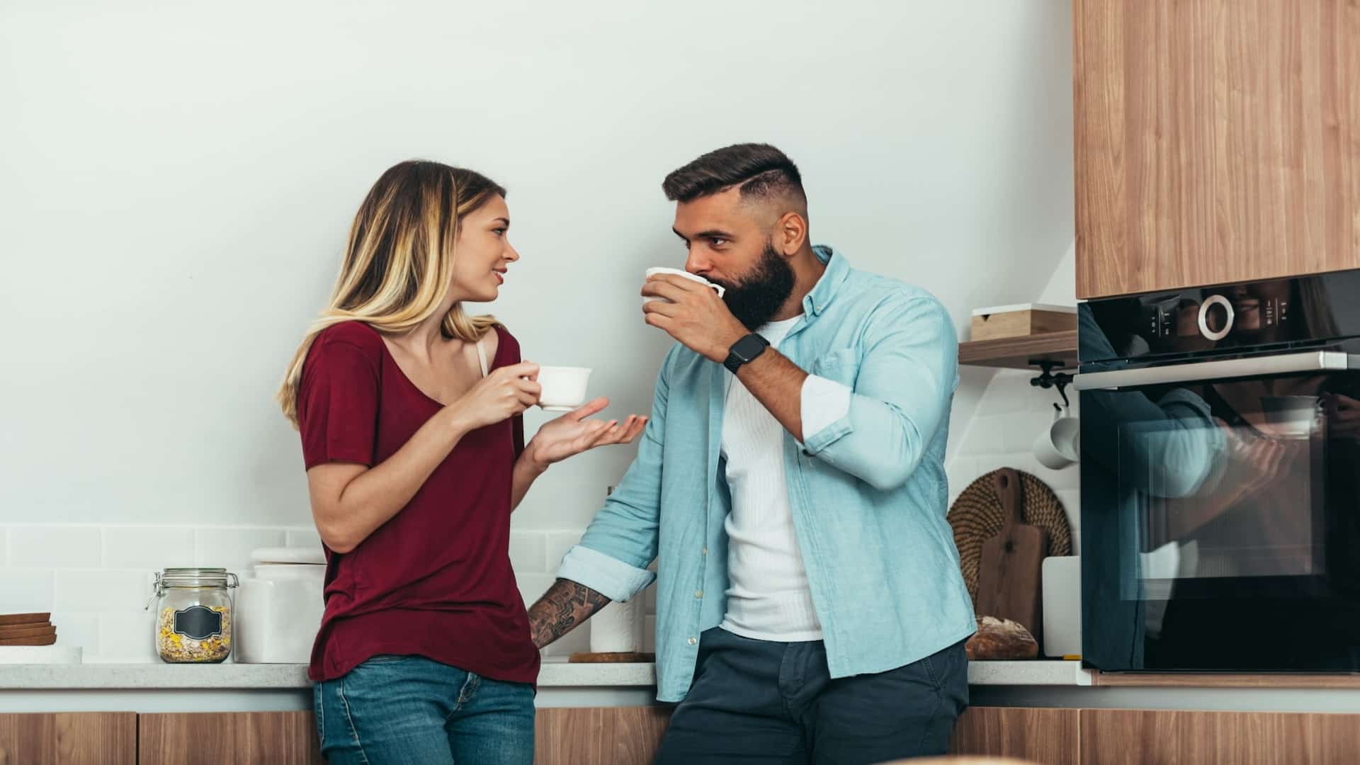 person bringing coffee to partner