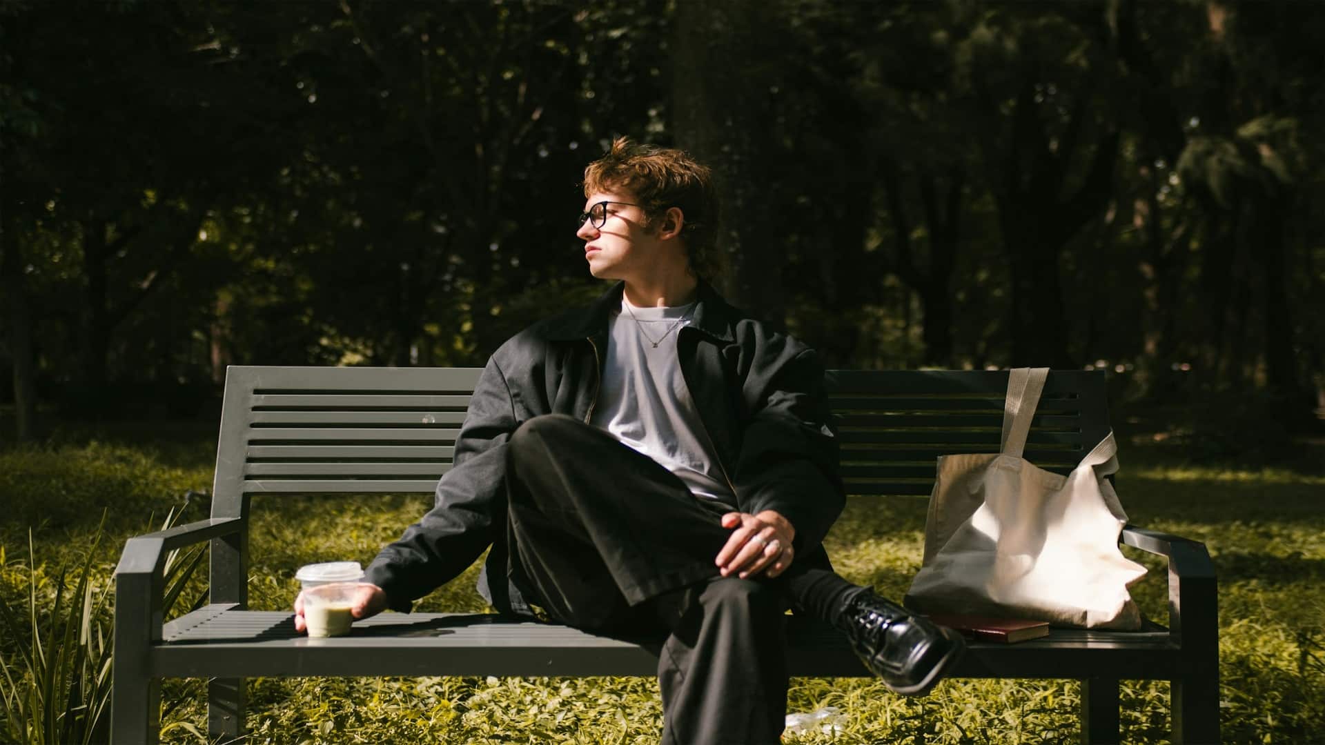 individual sitting alone on bench
