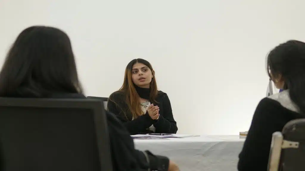 woman speaking confidently during conversation