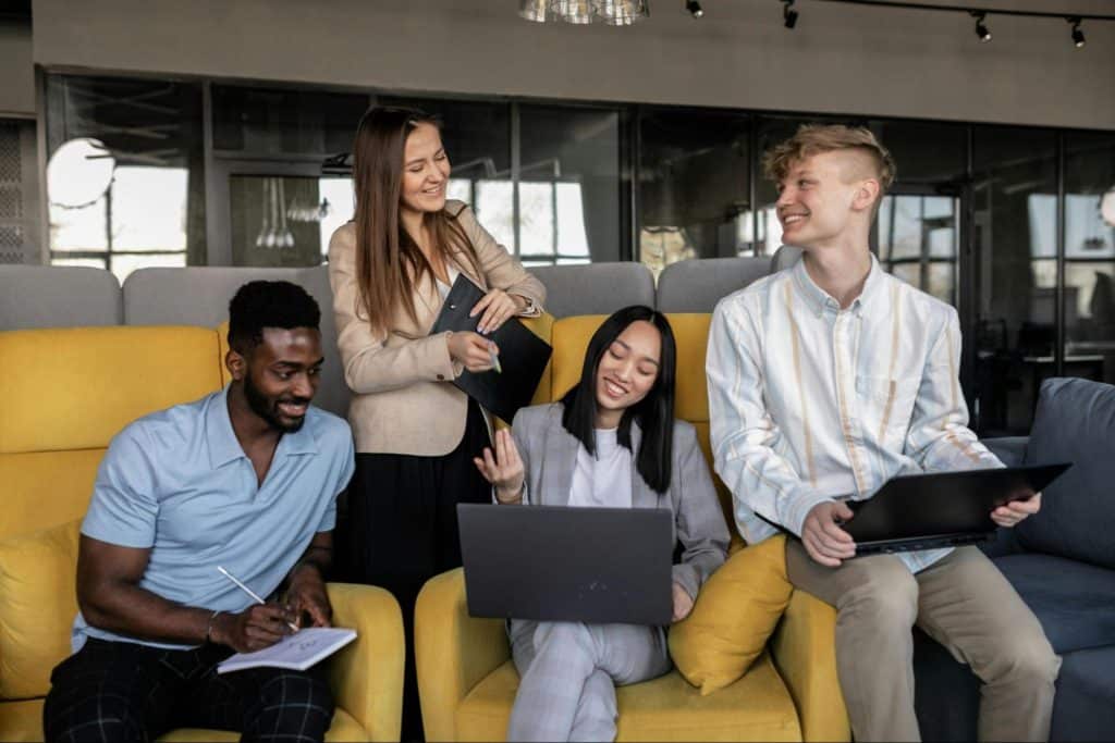 A man and woman with their colleagues 