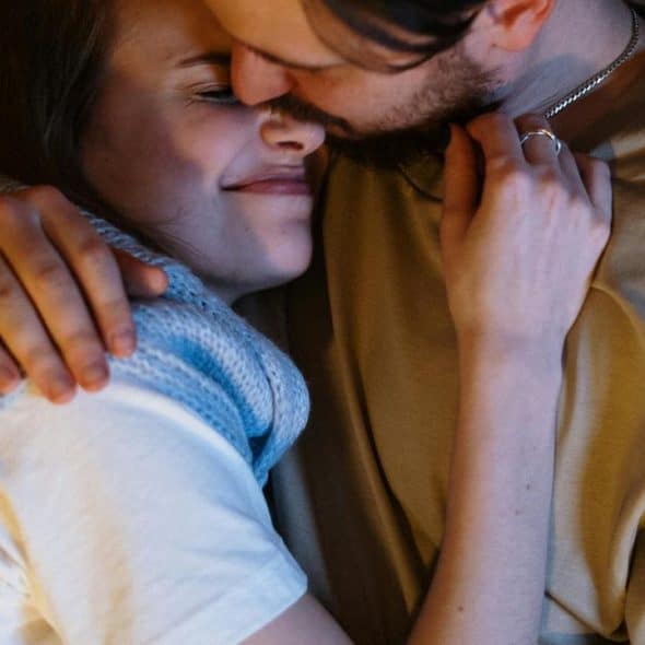 A couple cuddling closely