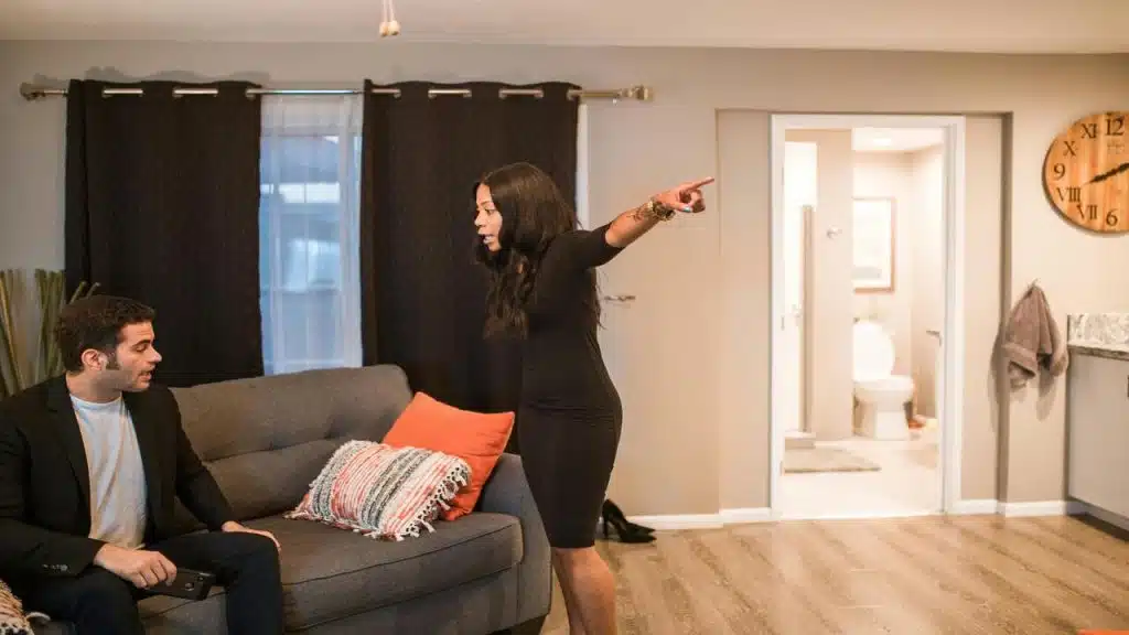 A couple arguing in the living room