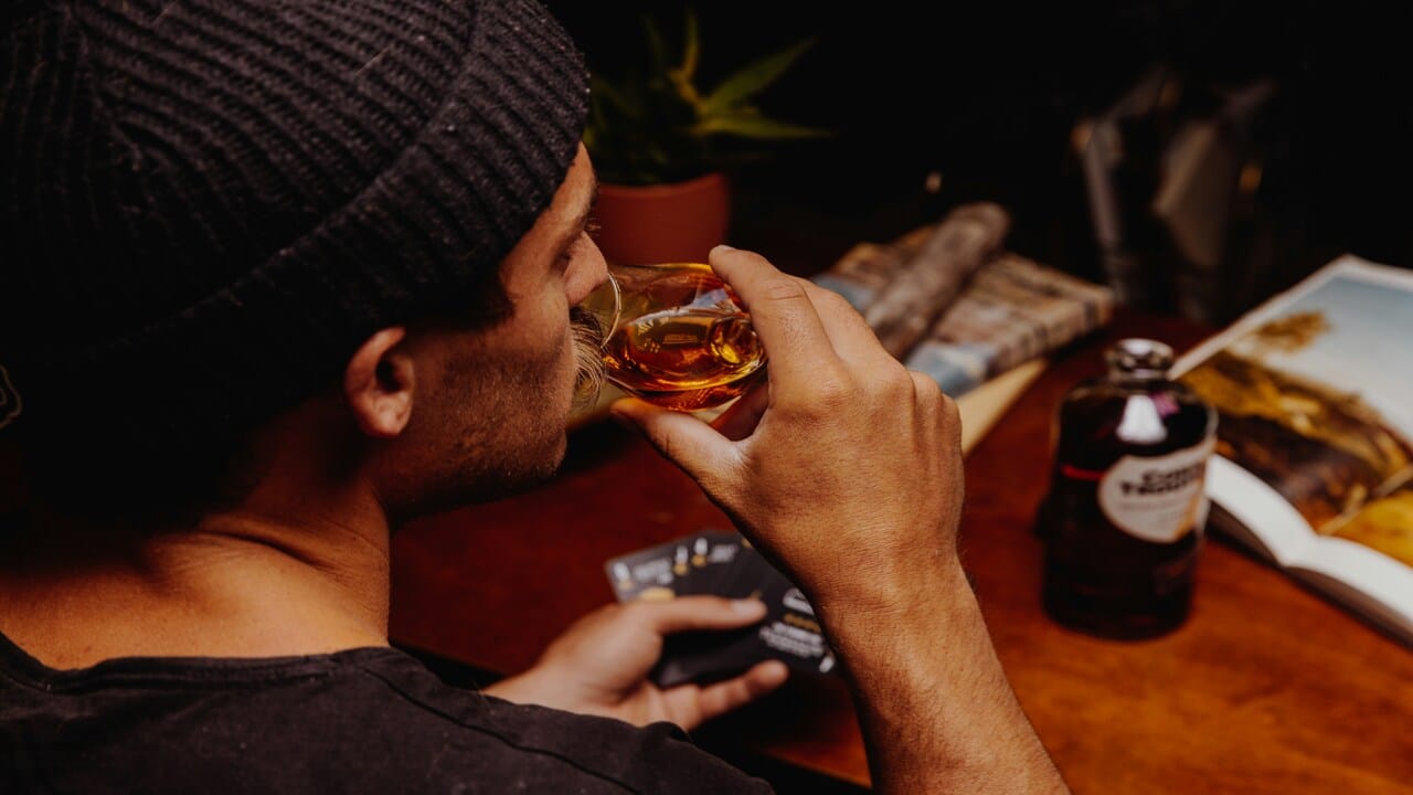A man drinking with friends