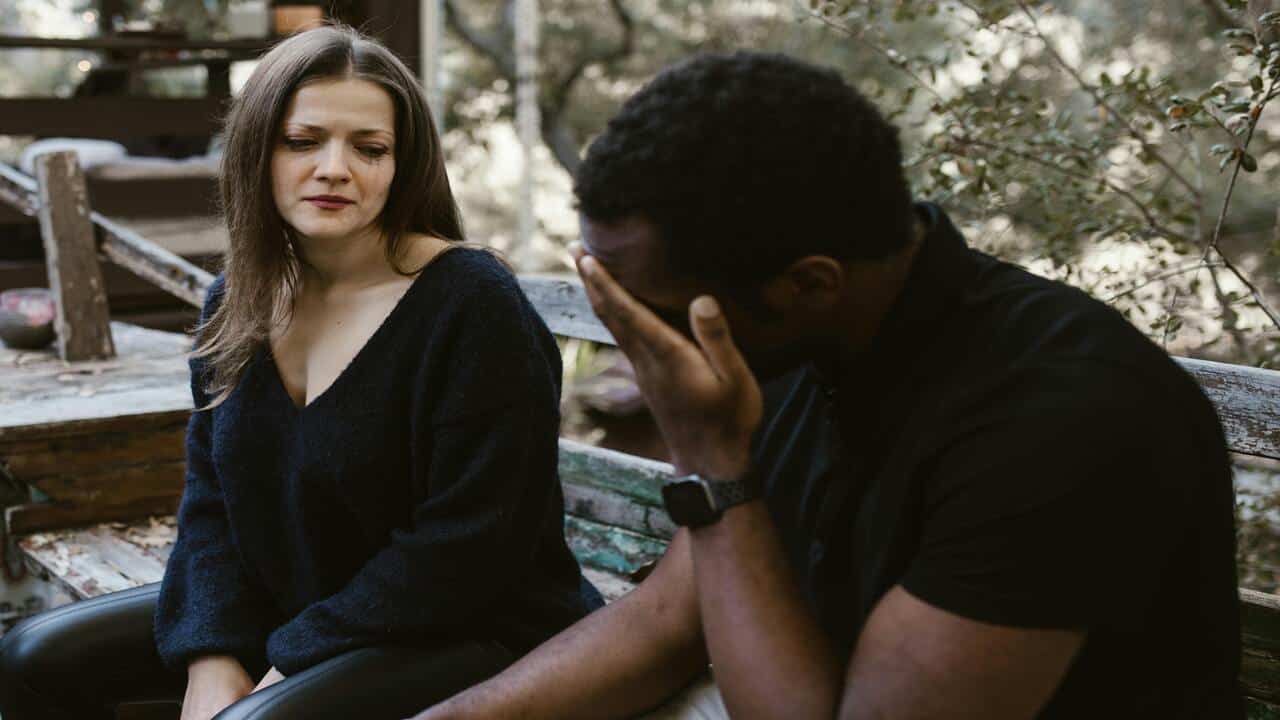 A couple crying while talking