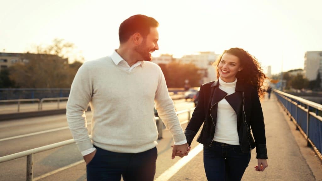 couple talking during sunset walk