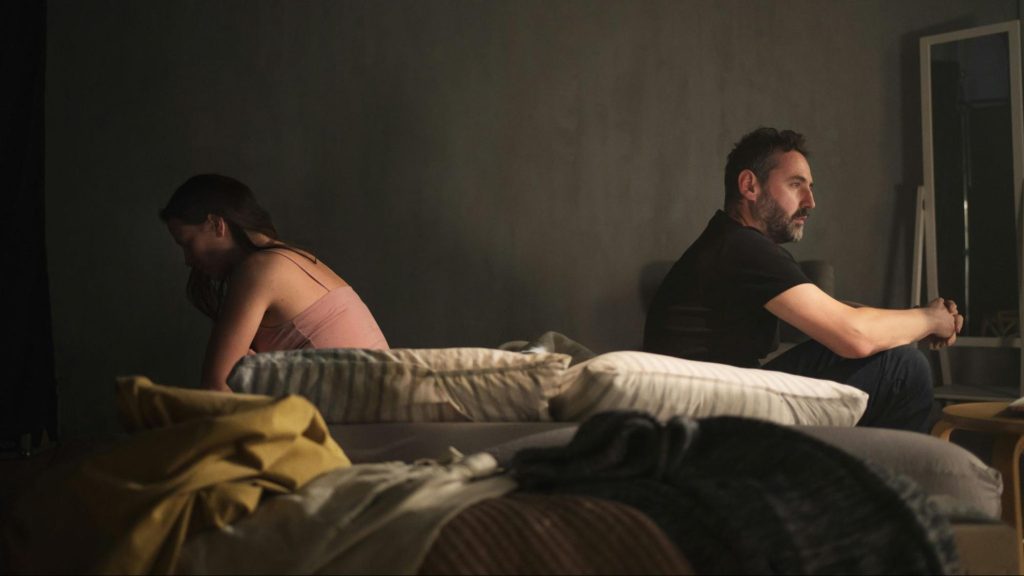 A man and woman not talking to each other