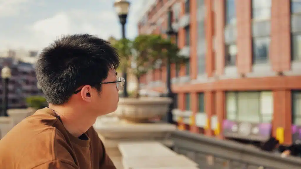 man reflecting quietly outdoors
