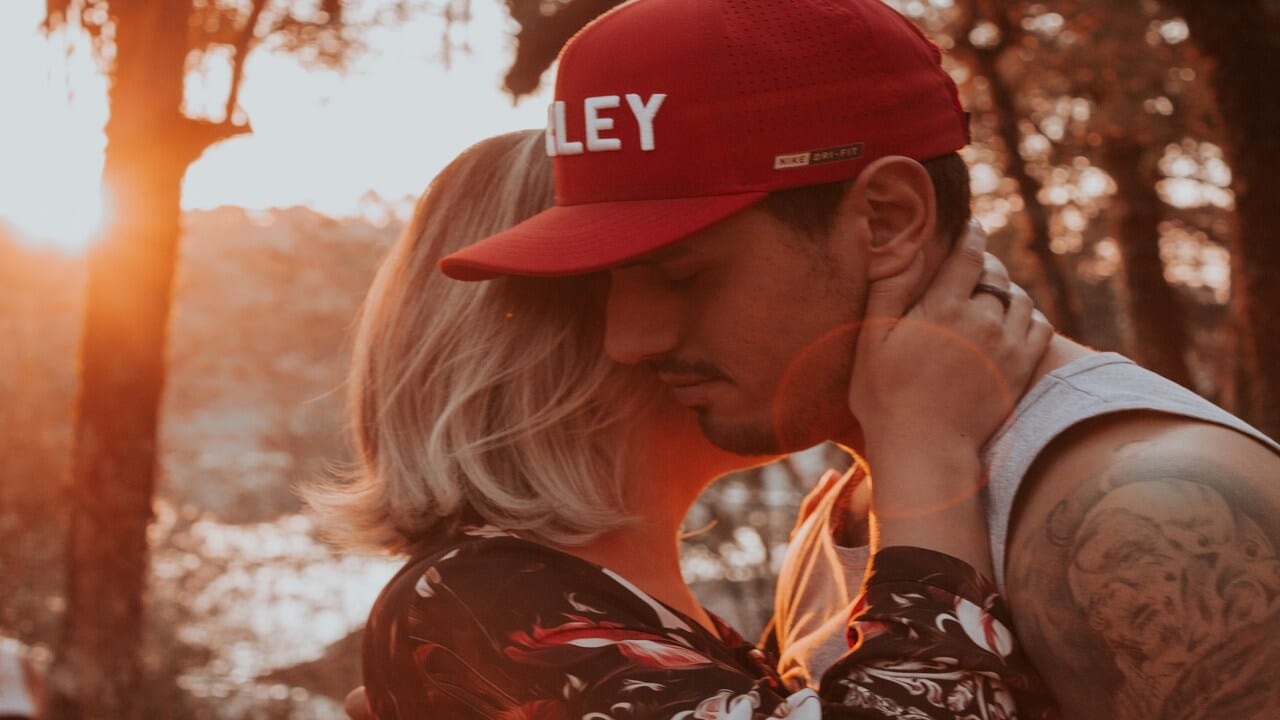 A couple hugging at sunset
