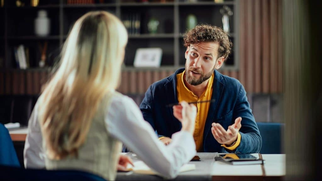 A man having a tone while talking to woman