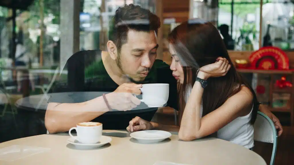 A couple having coffee together in a restaurant.