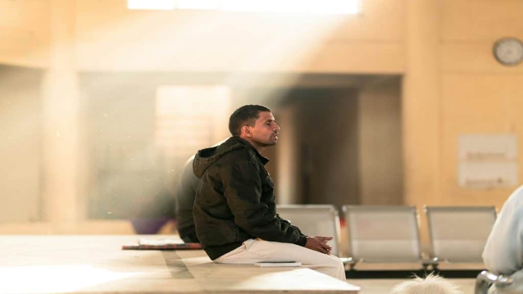 man sitting quietly reflecting