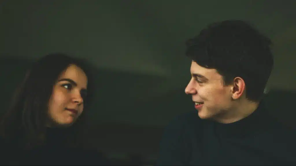 A man and woman talking