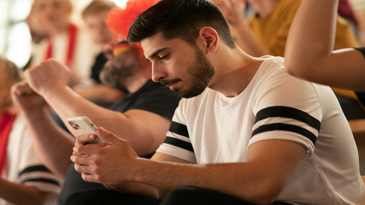 A man looking sad while texting