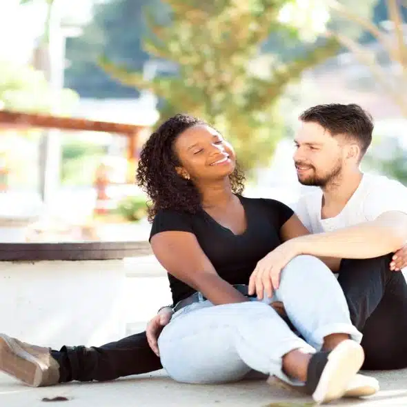 couple sitting together with one person more engaged