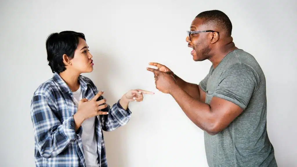 A man and woman arguing with each other.