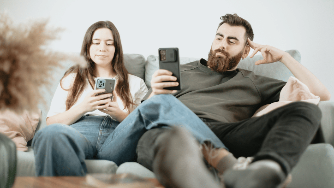 A couple looking bored at home