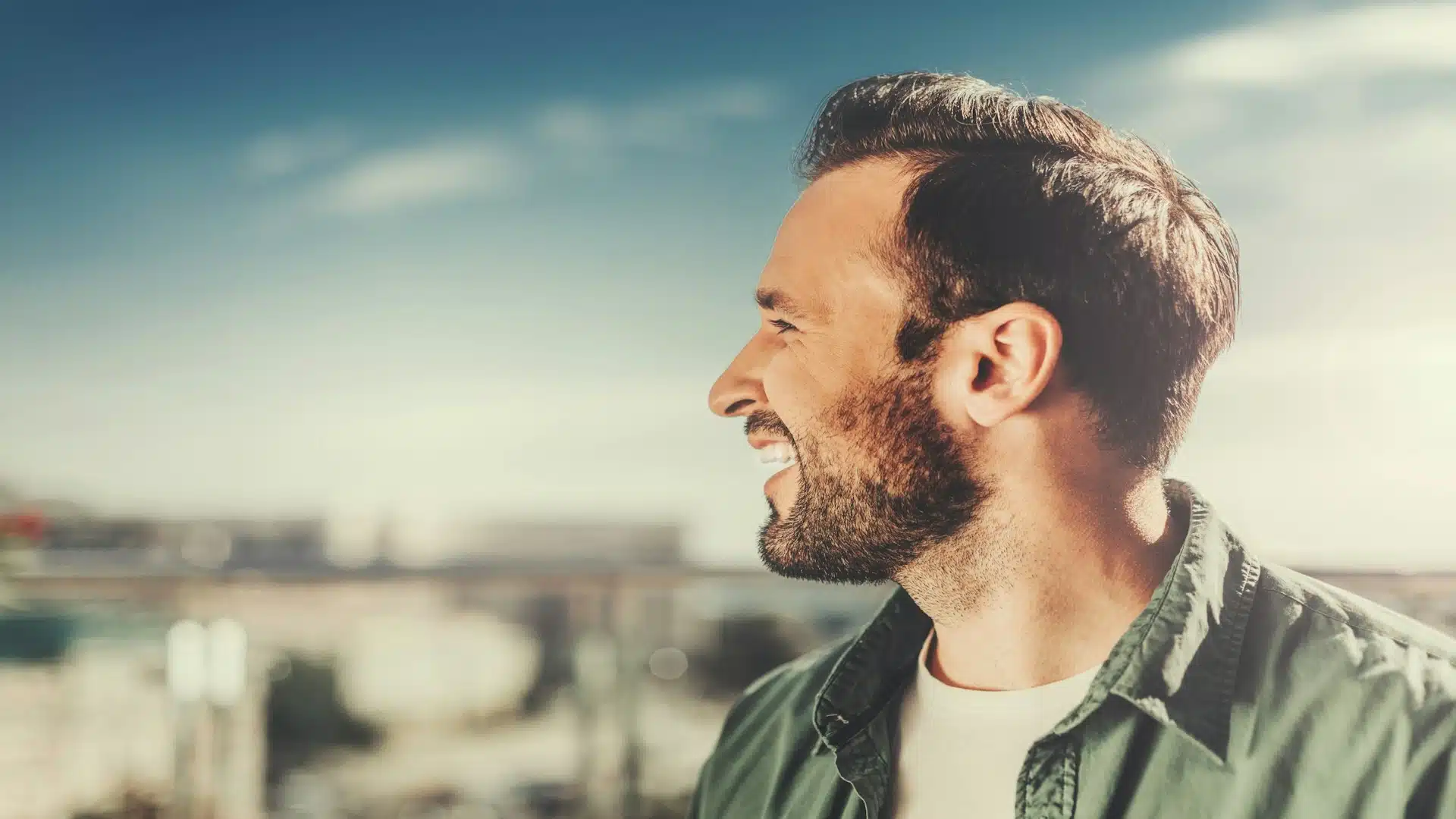 man smiling outdoors