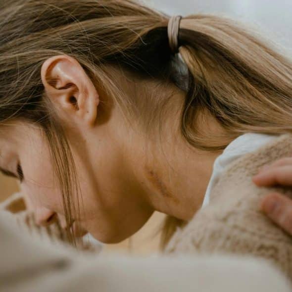A woman with her head down