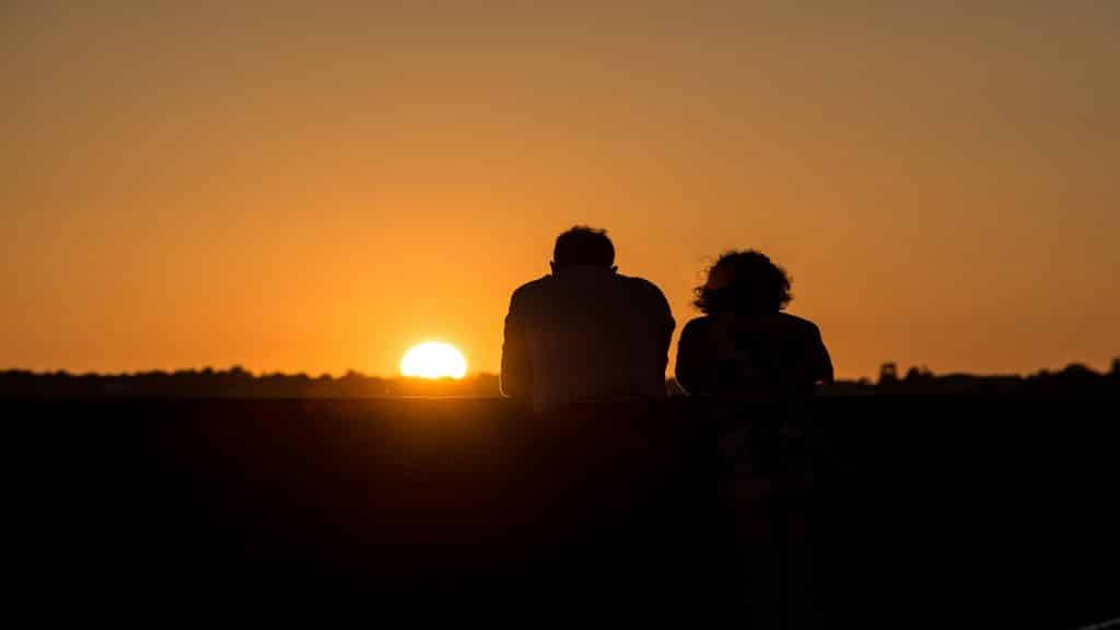 couple watching sunset together