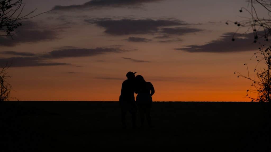 couple watching sunset together