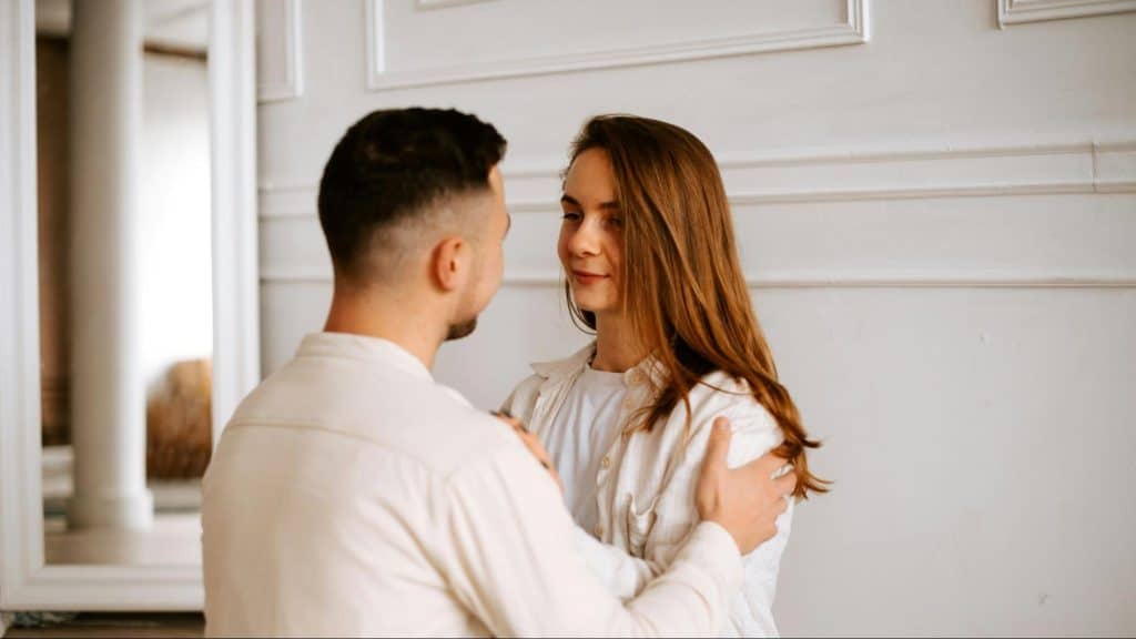 A man talking to woman 