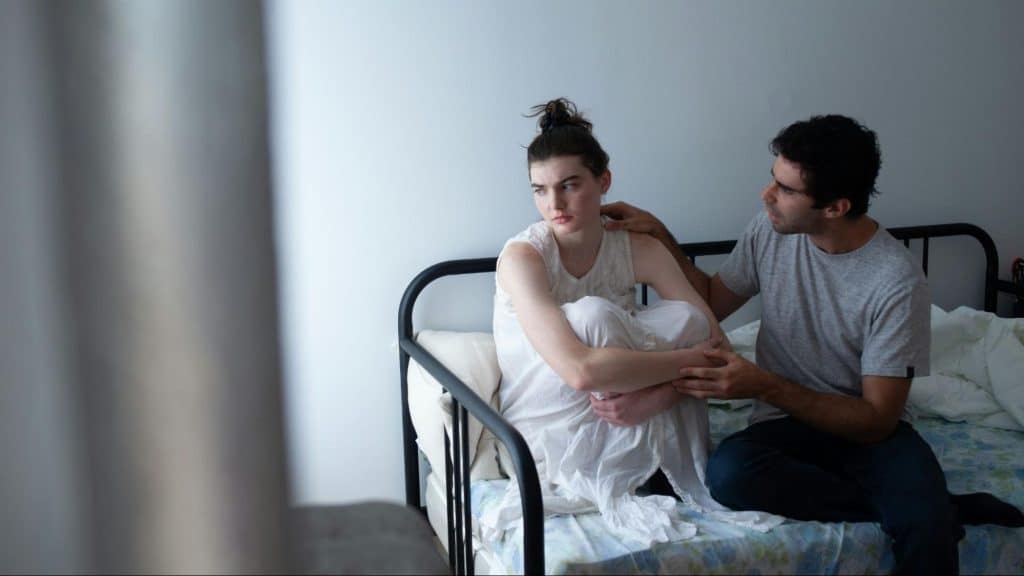 A man talking to woman