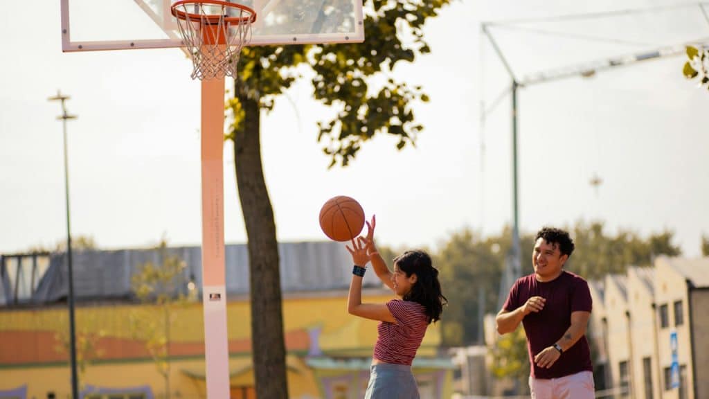 A couple at a basketball court.