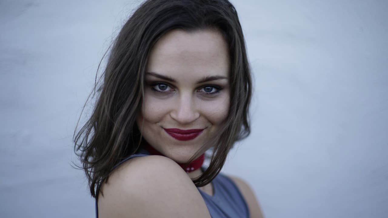 Close-up of a smiling woman.