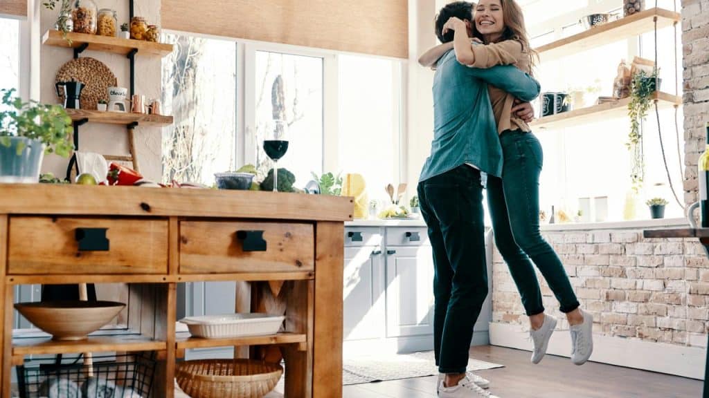 A couple hugs happily
