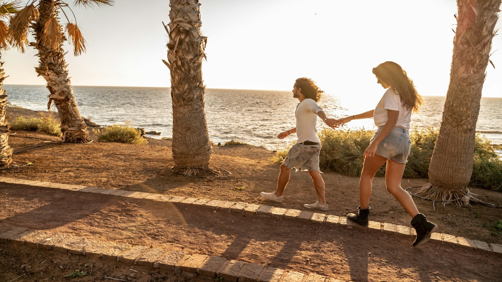 couple walking together at sunset
