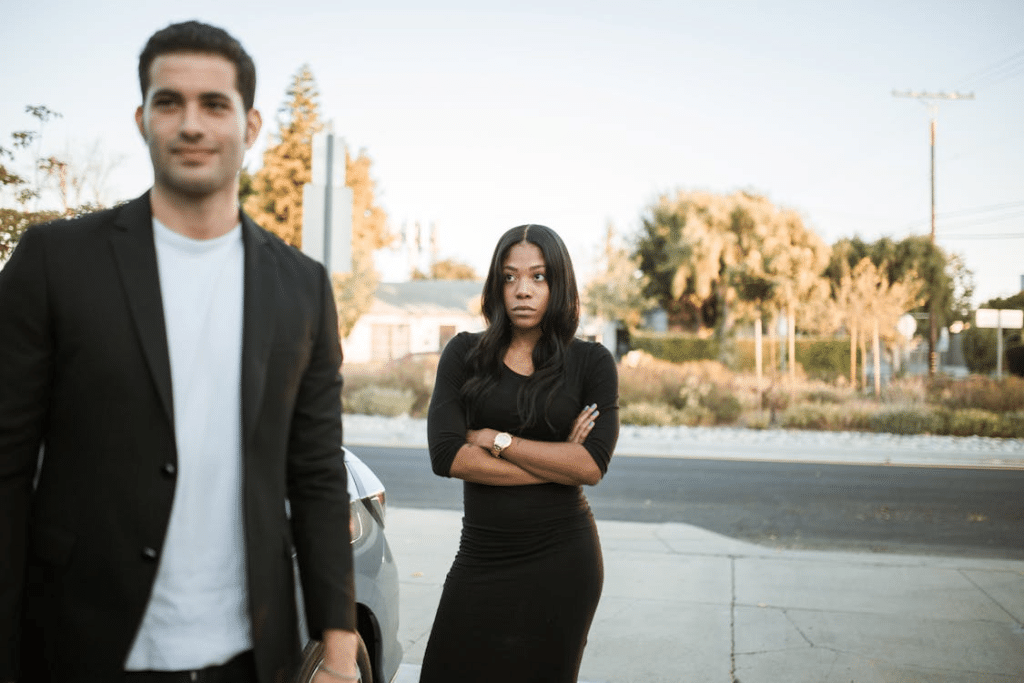 Upset woman looking coldly at man
