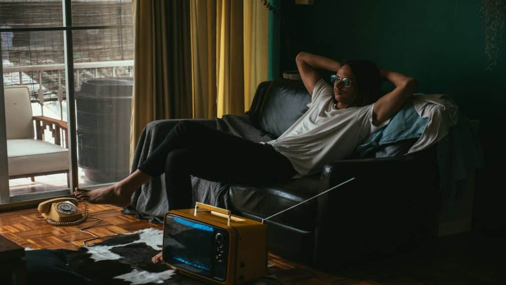 man relaxing alone in living room