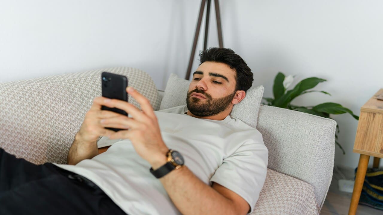 A man waiting for a text