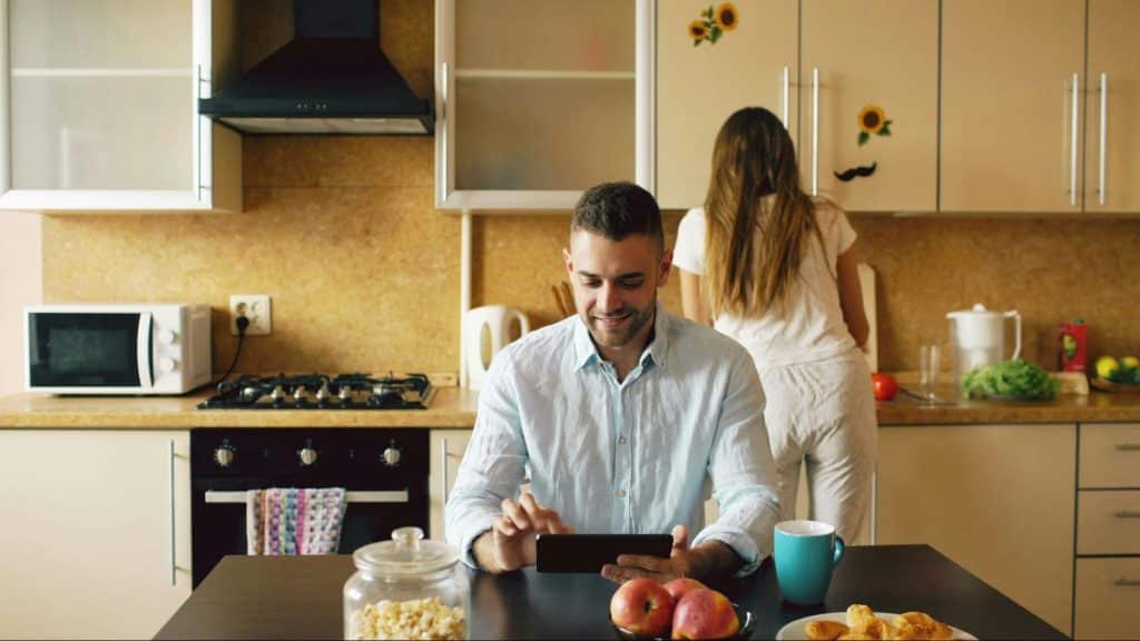 A man and woman at the kitchen