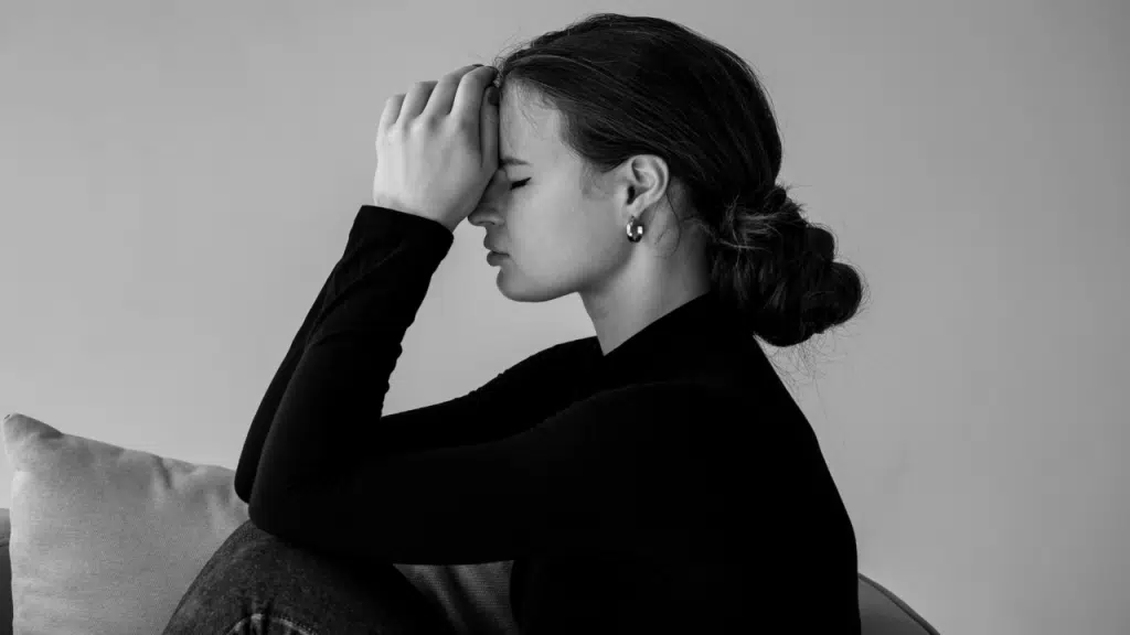 A woman looking upset at home