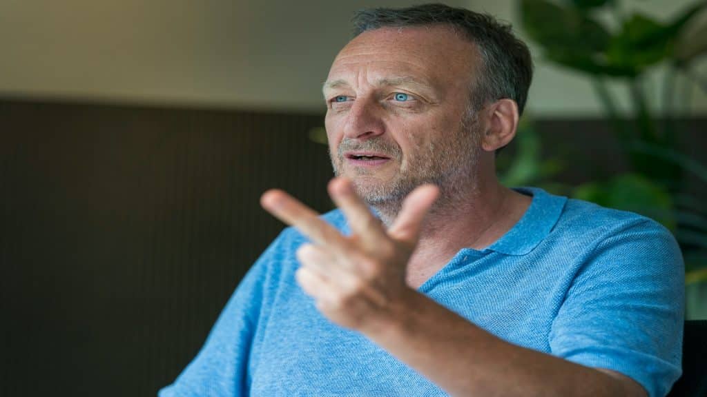 man speaking during discussion