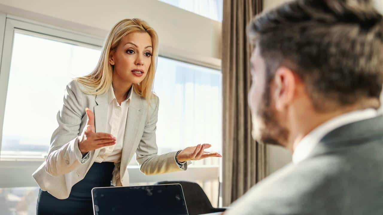 A woman gesturing while speaking