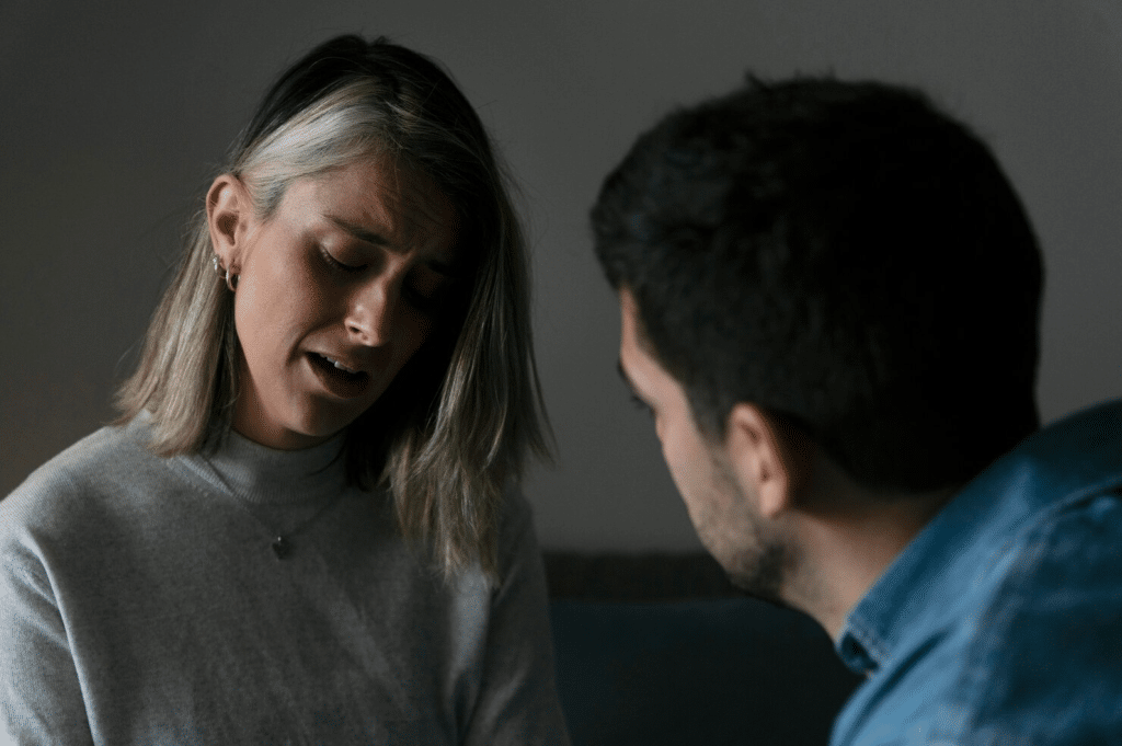 A man talking to woman