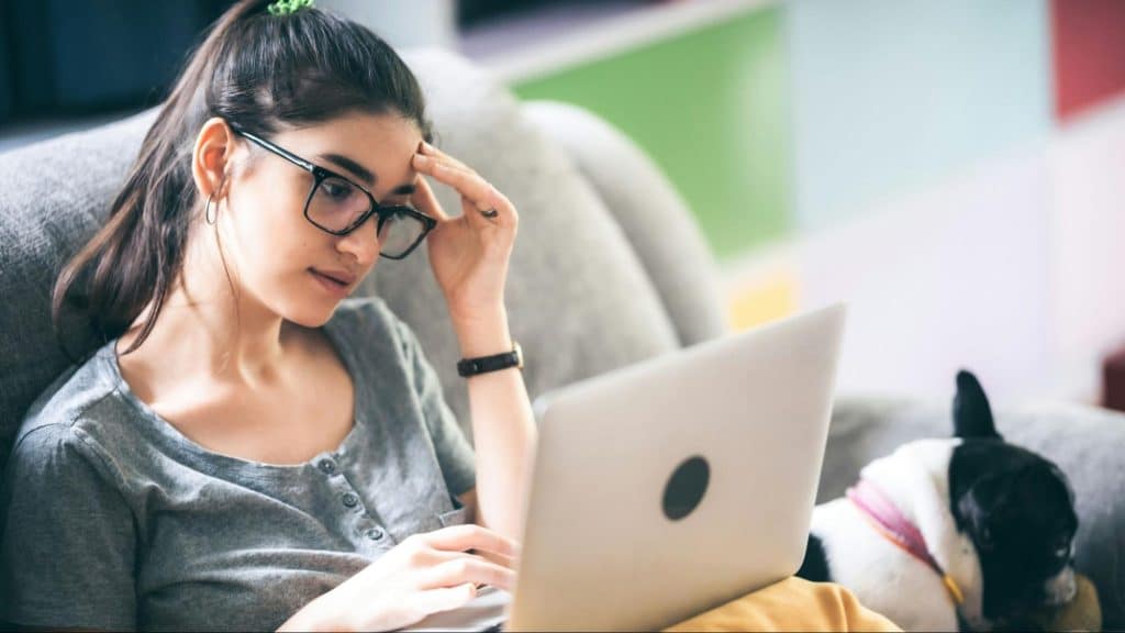 Woman looking exhausted while working 