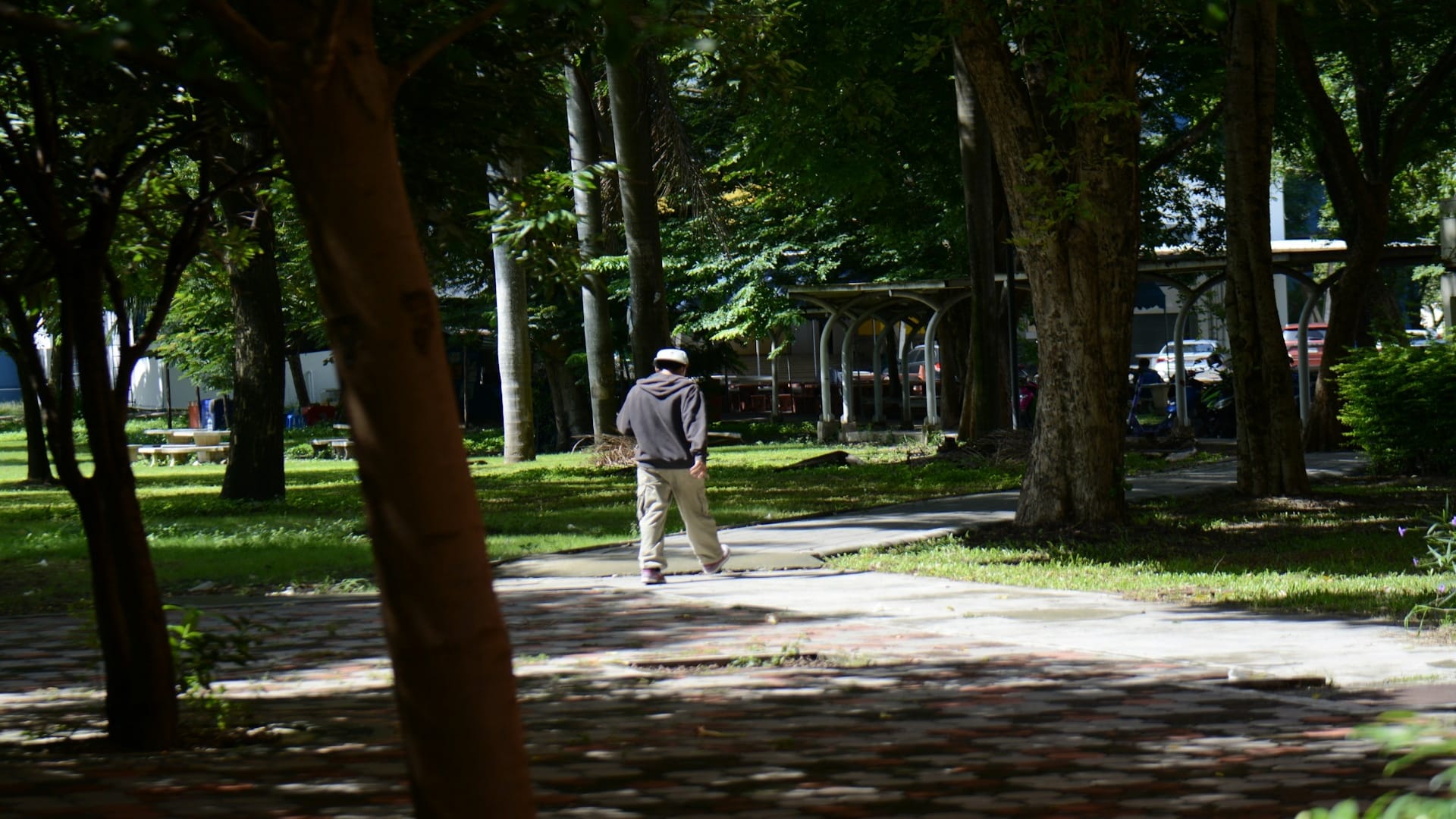 man walking outdoors thoughtfully