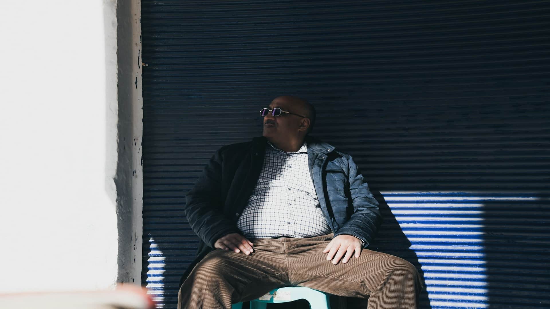 man sitting thoughtfully during conversation